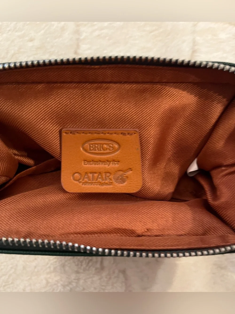Bric's green faux-leather amenity kit bag. Unisex